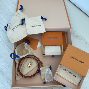 Authentic Louis Vuitton box, authentic lock, authentic strap